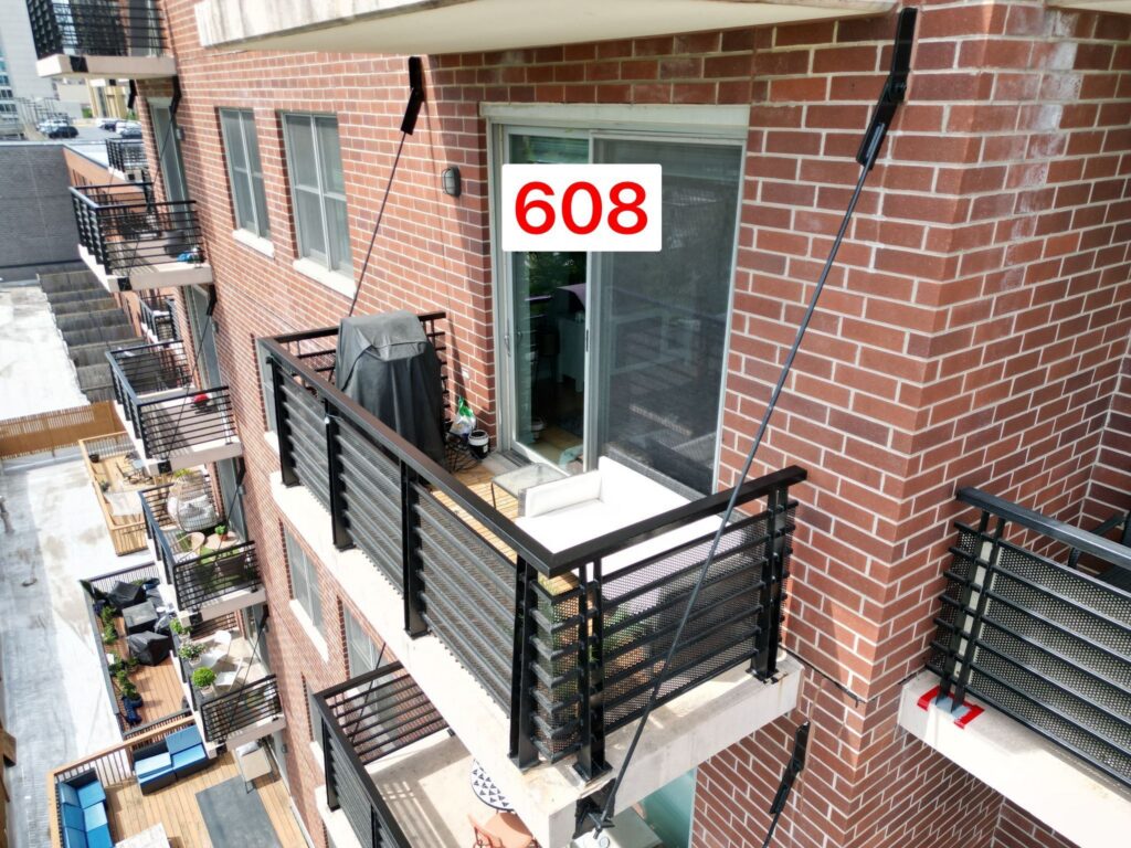 Aerial view of a condo balcony refinished by North Shore Masonry