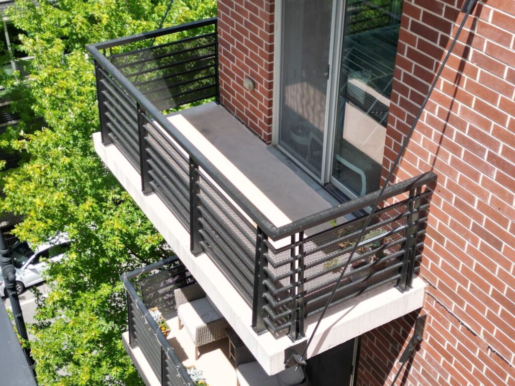 Balcony Refinishing & Sealant Program Aerial detail of balcony rails and slab edges